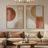 Living room with a beige sectional sofa, round coffee table, and abstract wall art.