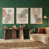 Modern living room with a green wall, beige sofa, and decorative elements.