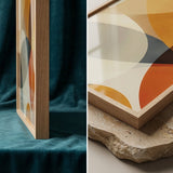 Framed abstract art piece on a wooden surface with a textured background.